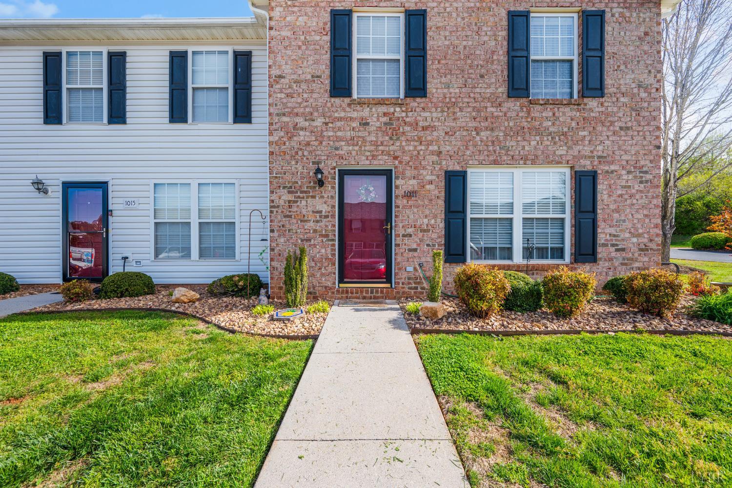 1011 Middle View Drive Forest, VA 24551 - Photo 3 of 44 a front view of a brick house with a yard