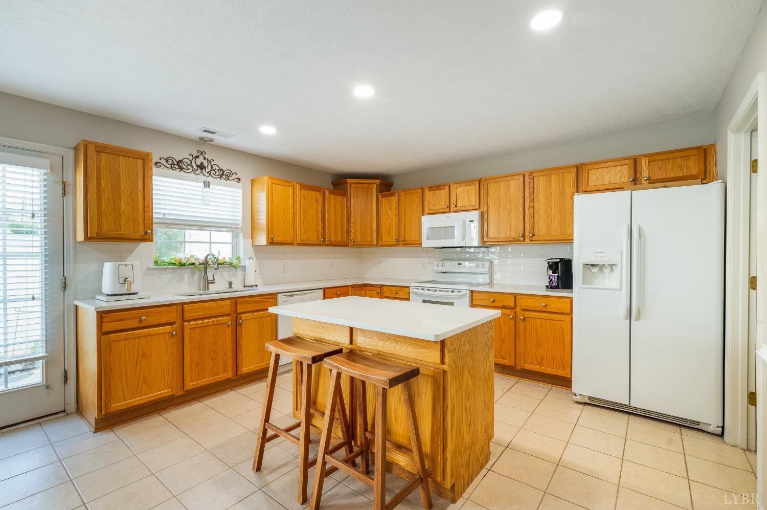 1011 Middle View Drive Forest, VA 24551 - Photo 10 of 44 a kitchen with stainless steel appliances granite countertop a refrigerator and a sink