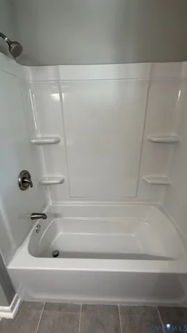 a view of a living room and entryway