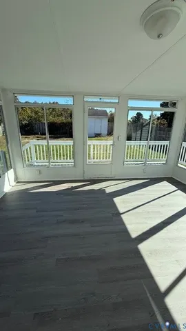 a view of balcony with wooden floor