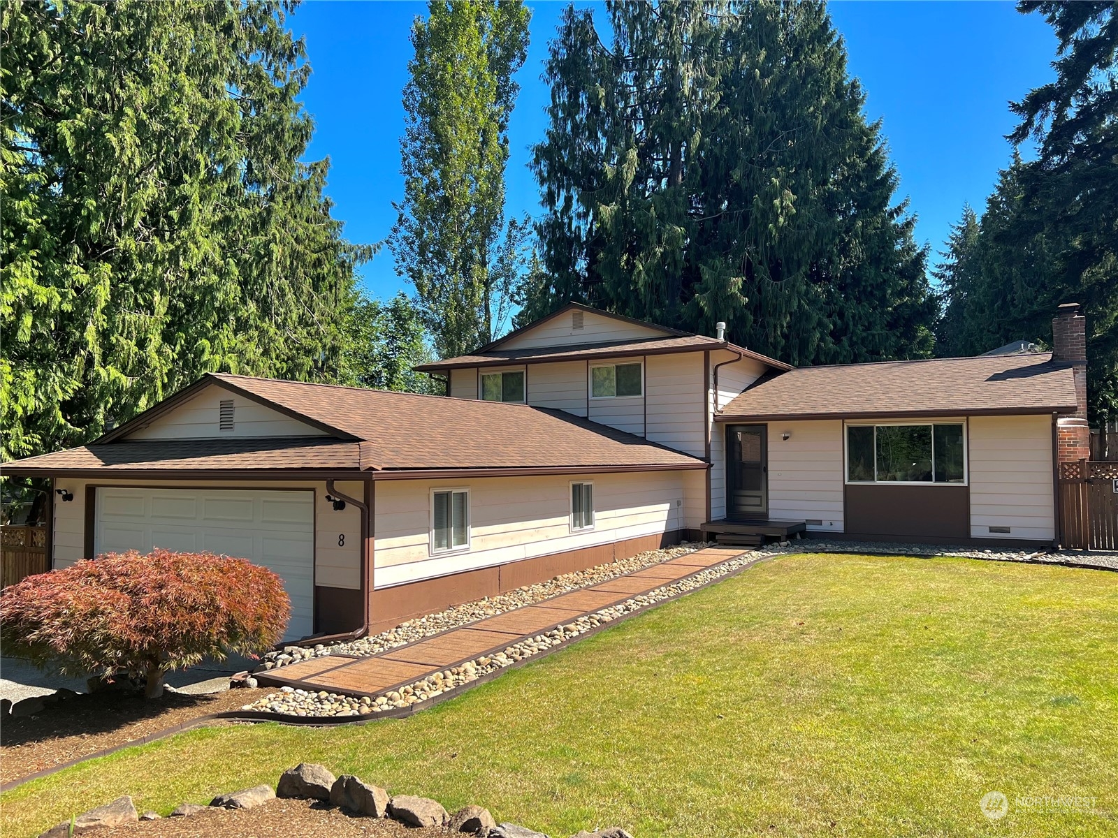 a front view of a house with a yard