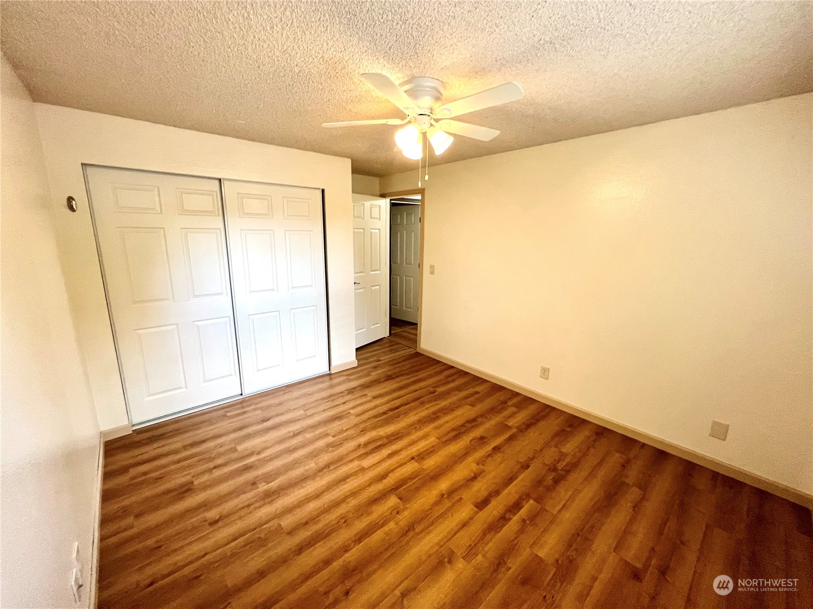 8 156th Place Southwest Bothell, WA 98012 - Photo 11 of 33 a view of empty room with wooden floor