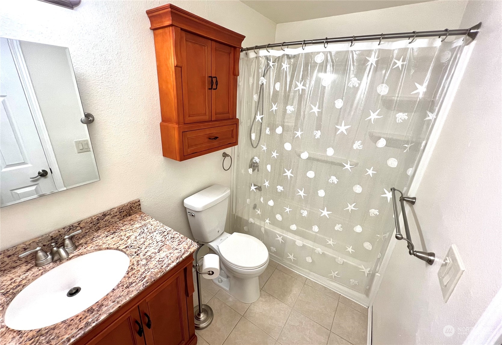 8 156th Place Southwest Bothell, WA 98012 - Photo 12 of 33 a bathroom with a granite countertop sink and a mirror