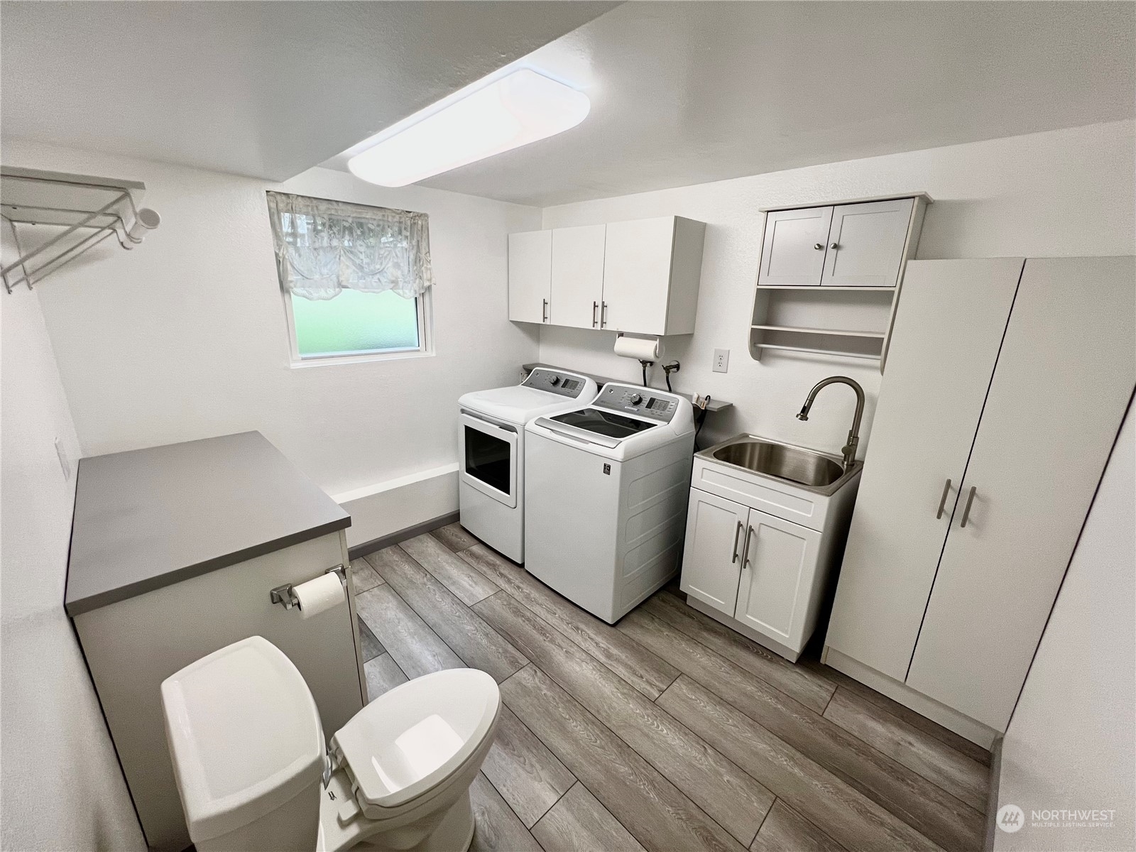 8 156th Place Southwest Bothell, WA 98012 - Photo 15 of 33 a kitchen with stainless steel appliances a stove a refrigerator and wooden floor