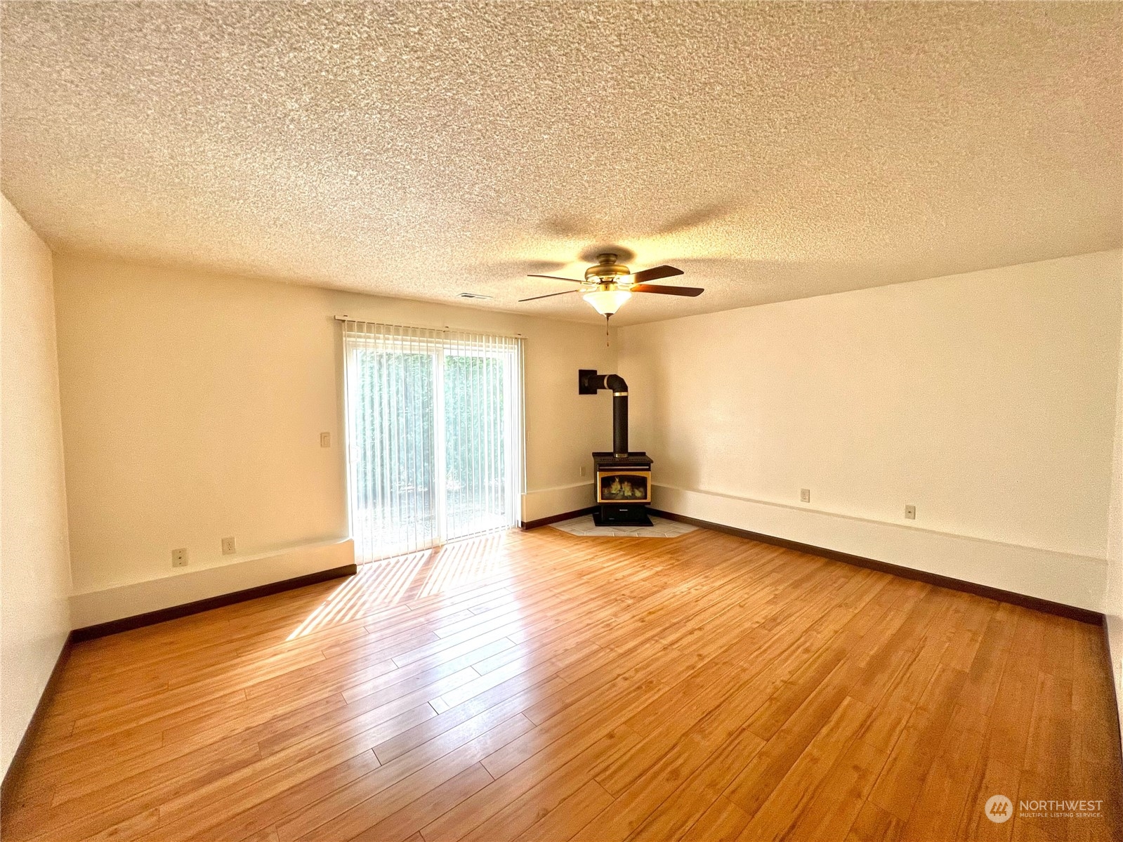 8 156th Place Southwest Bothell, WA 98012 - Photo 16 of 33 an empty room with wooden floor and windows