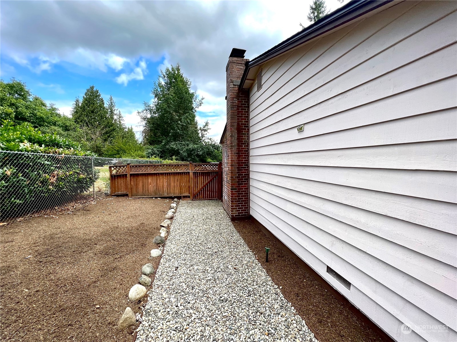 8 156th Place Southwest Bothell, WA 98012 - Photo 20 of 33 a view of a backyard with sitting area