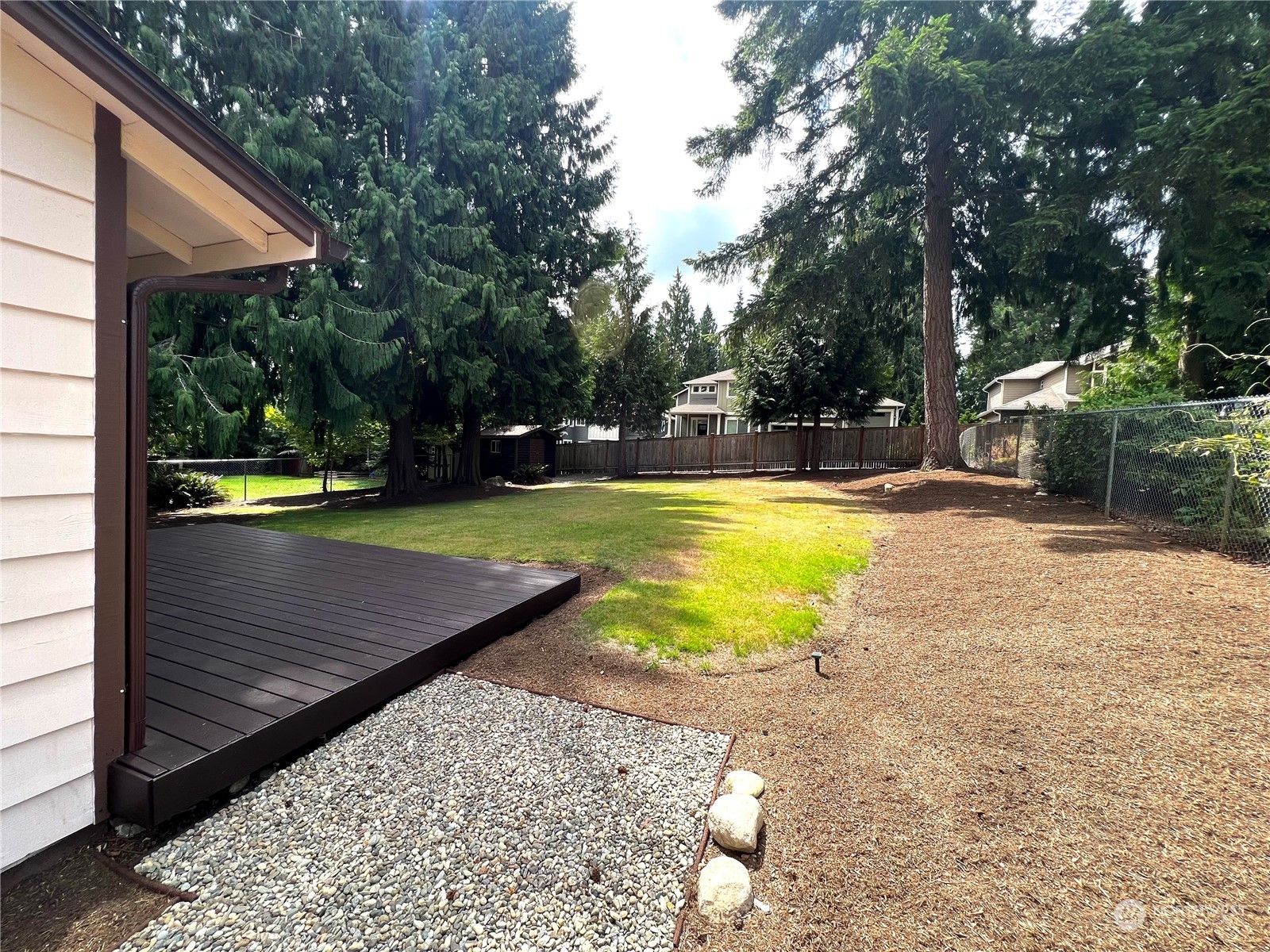 8 156th Place Southwest Bothell, WA 98012 - Photo 21 of 33 a view of a swimming pool with a patio and a yard