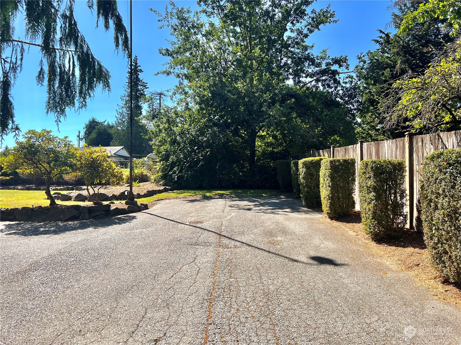 8 156th Place Southwest Bothell, WA 98012 - Photo 3 of 33 a view of a street with a building and trees