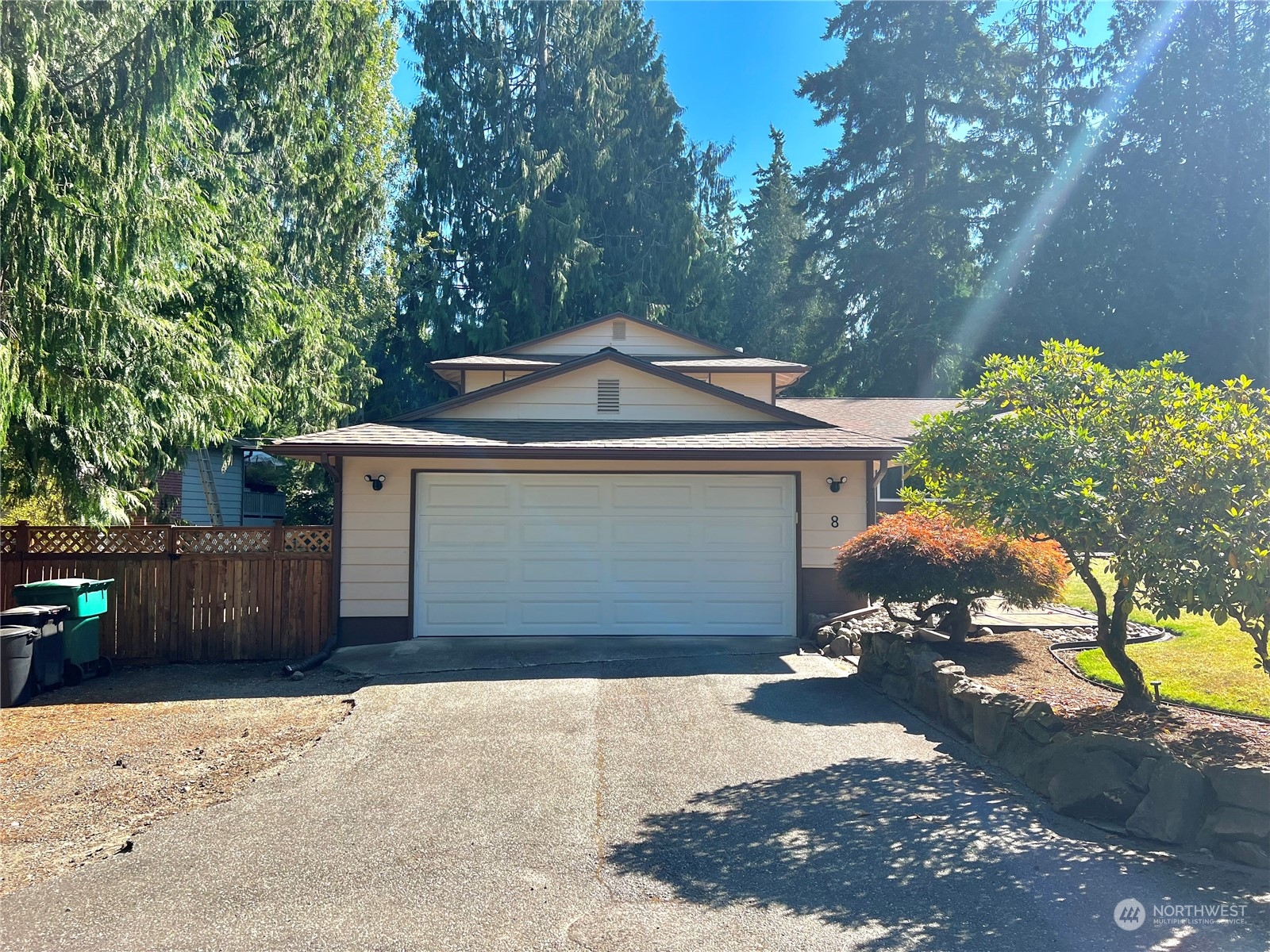 8 156th Place Southwest Bothell, WA 98012 - Photo 4 of 33 a front view of a house with a yard and garage