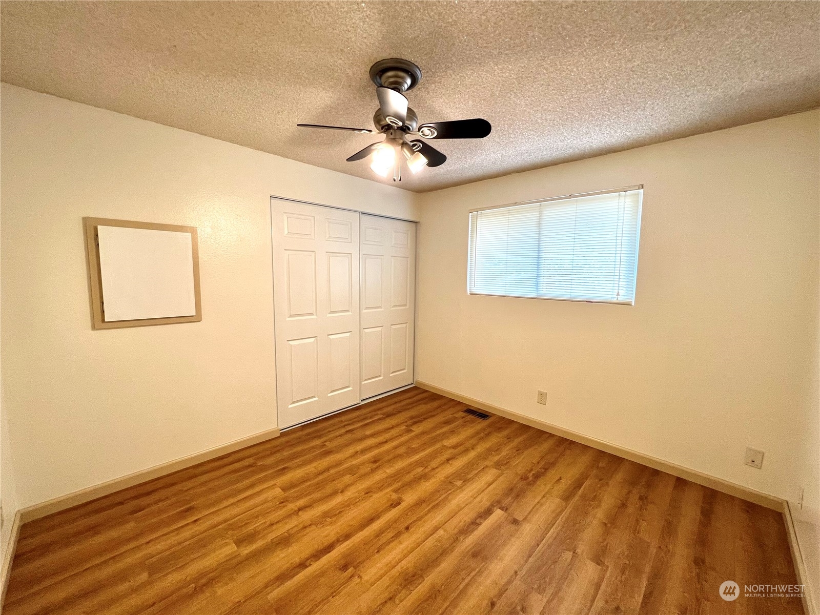 8 156th Place Southwest Bothell, WA 98012 - Photo 10 of 33 a view of empty room with wooden floor