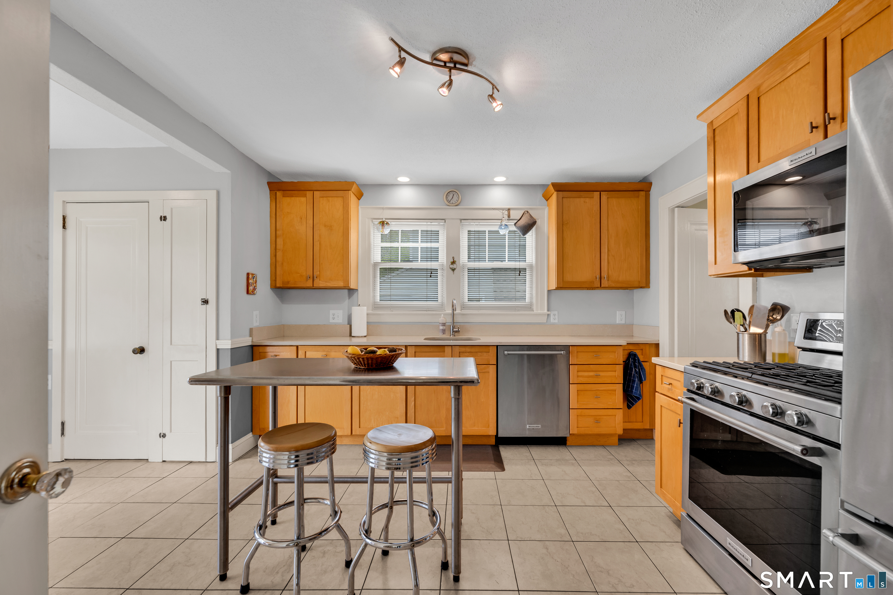 44 Beverly Road Wethersfield, CT 06109 - Photo 6 of 31 a kitchen with stainless steel appliances granite countertop a sink and cabinets