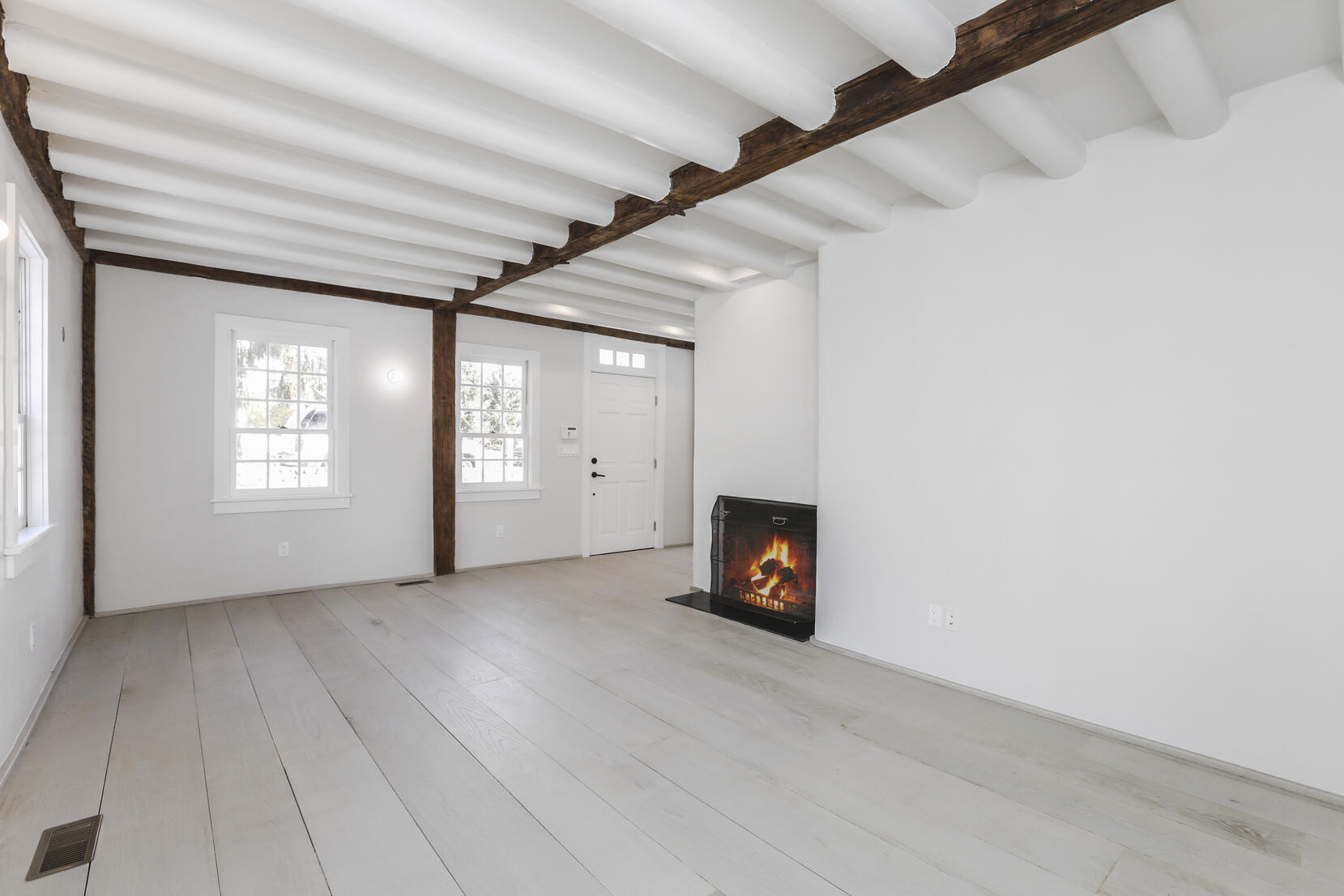 25 Brookside Road Darien, CT 06820 - Photo 12 of 30 an empty room with windows and fireplace