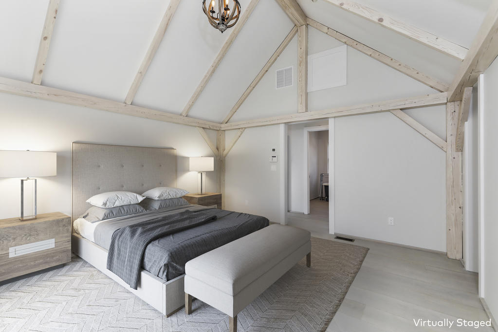 25 Brookside Road Darien, CT 06820 - Photo 16 of 30 a bedroom with a bed and a lamp