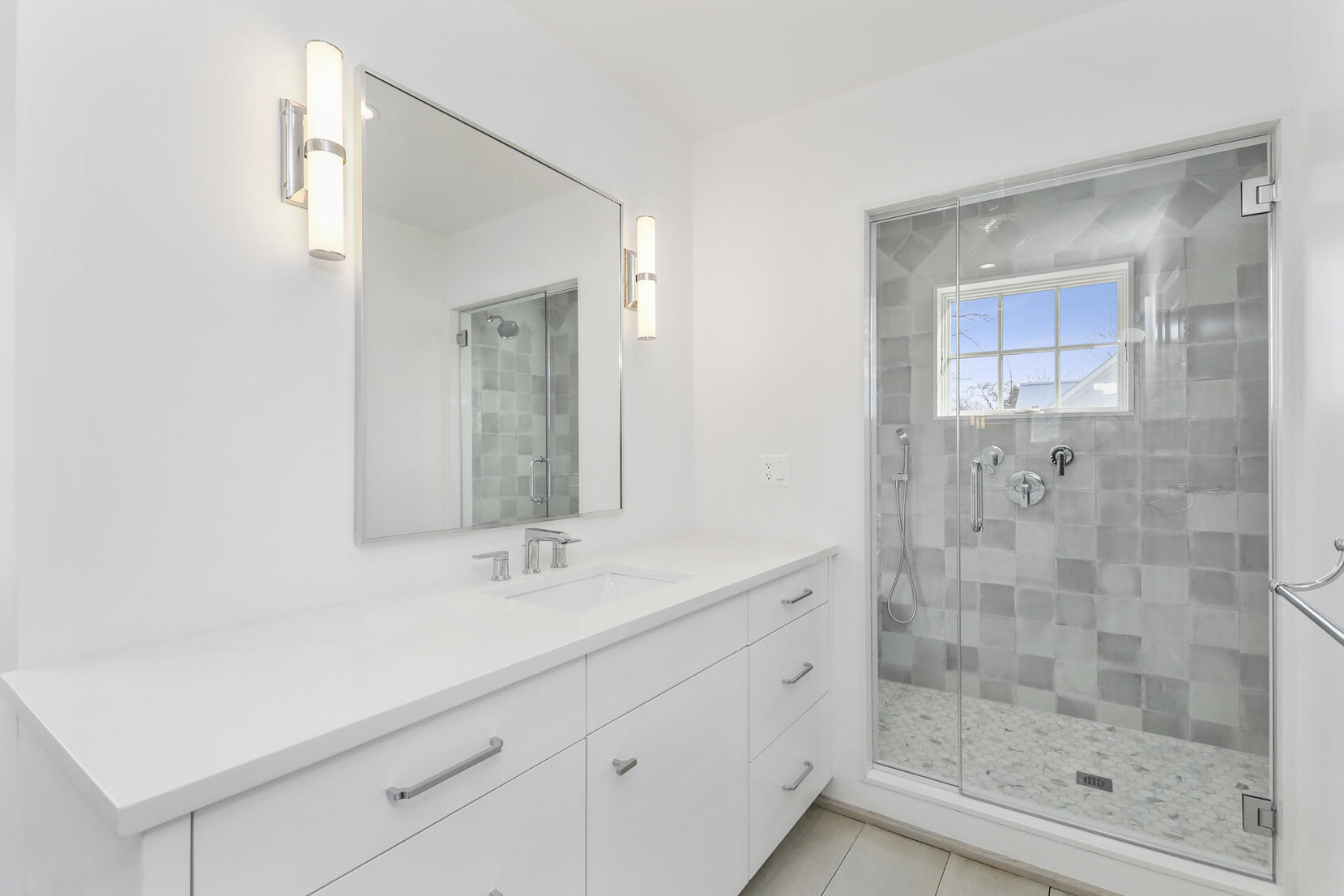 25 Brookside Road Darien, CT 06820 - Photo 18 of 30 a bathroom with a shower sink and mirror