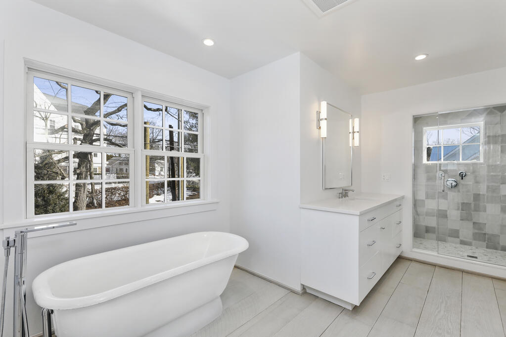 25 Brookside Road Darien, CT 06820 - Photo 20 of 30 a bathroom with a granite countertop sink a toilet and shower