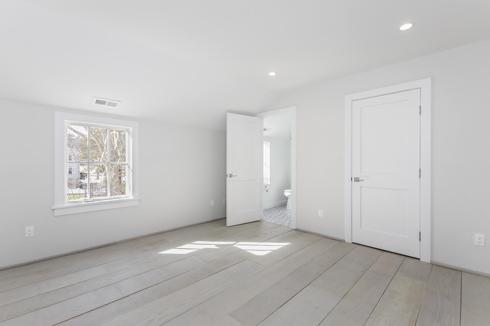 25 Brookside Road Darien, CT 06820 - Photo 25 of 30 an empty room with wooden floor and windows