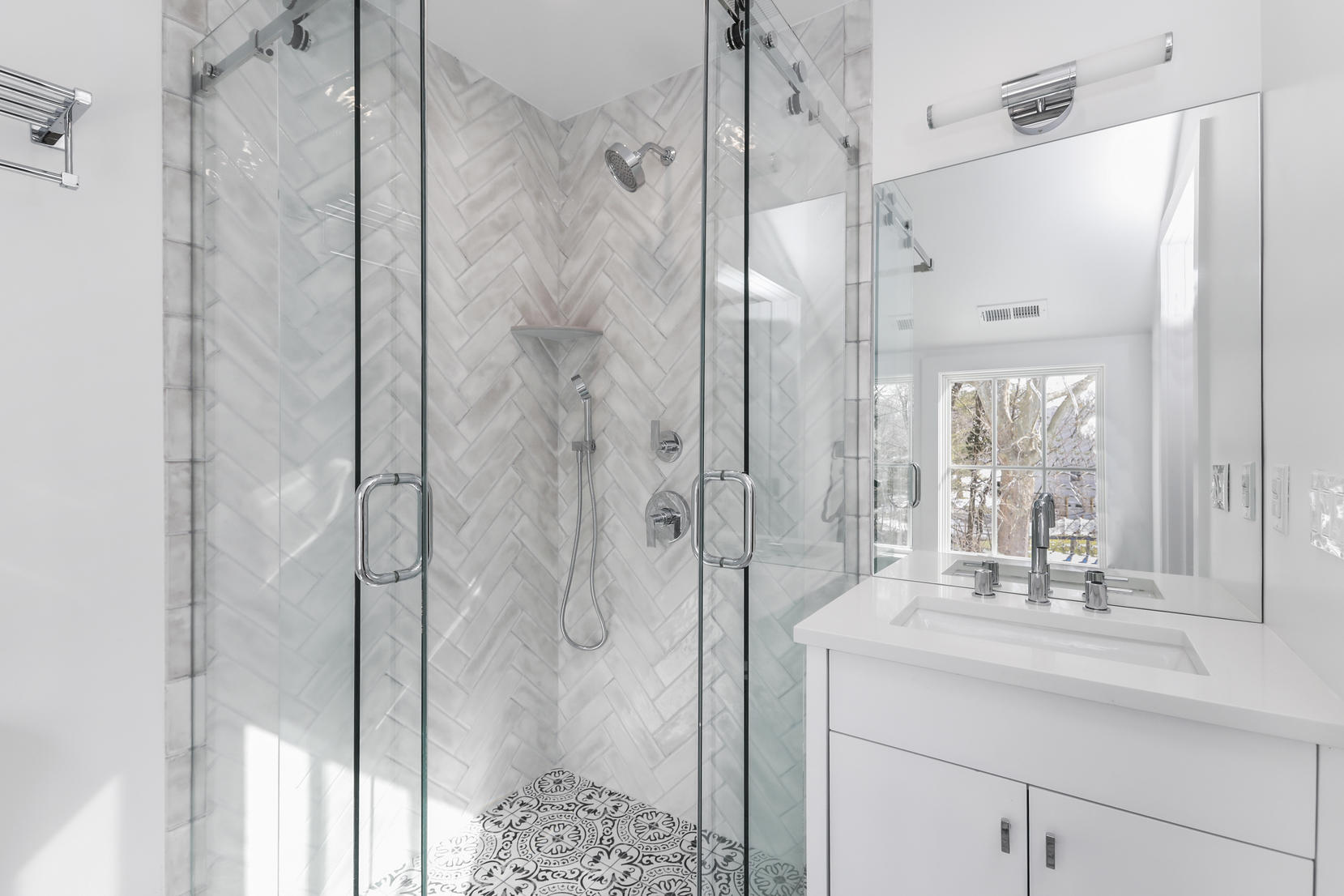 25 Brookside Road Darien, CT 06820 - Photo 26 of 30 a bathroom with a shower sink and mirror