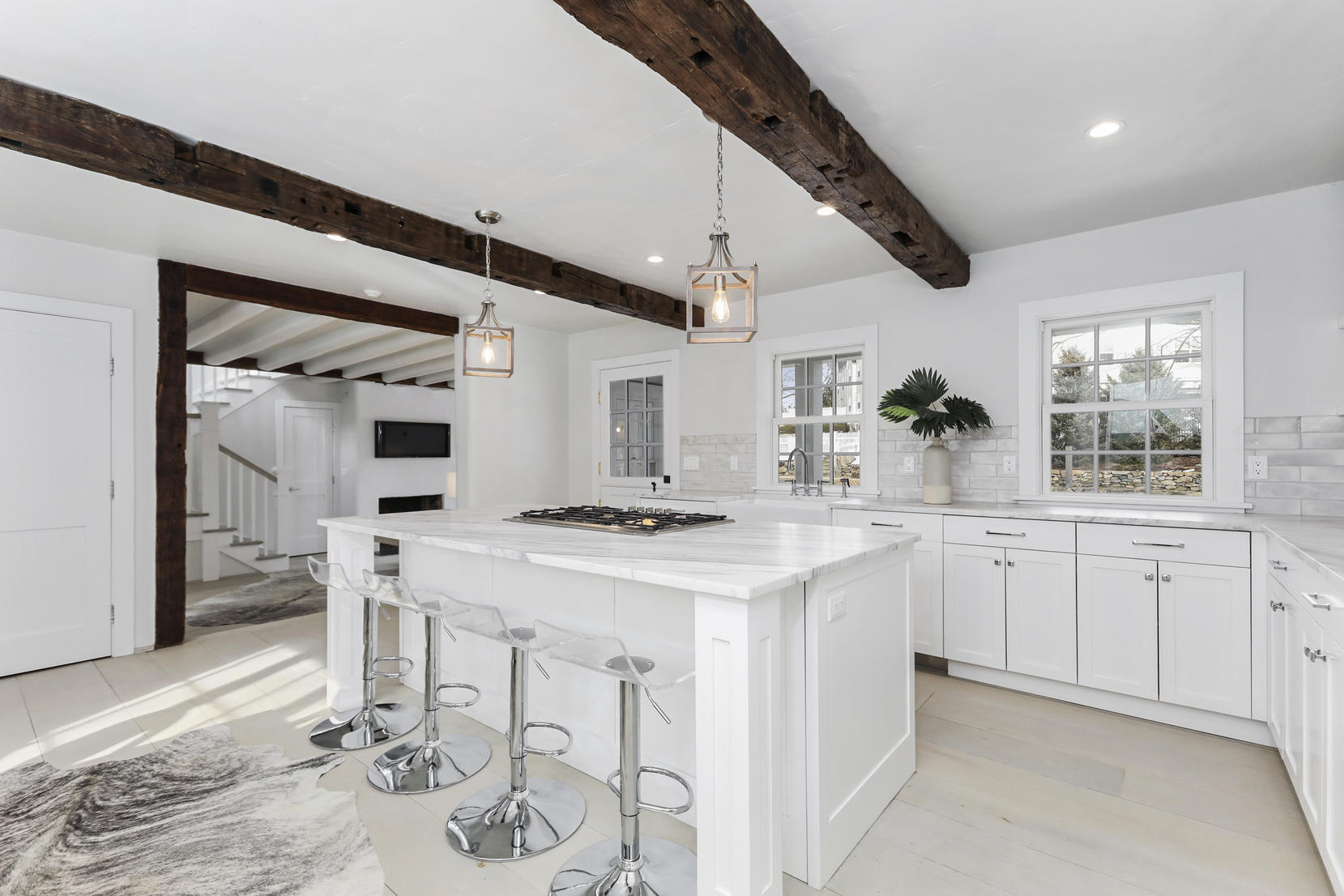 25 Brookside Road Darien, CT 06820 - Photo 5 of 30 a kitchen with white cabinets and stove