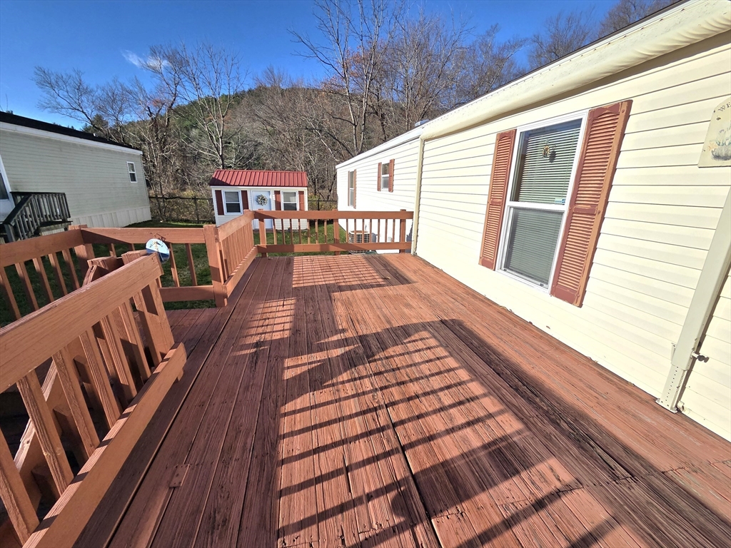 268 Palmer Road, Unit 59 Monson, MA 01057 - Photo 3 of 27 a view of outdoor space with deck and patio