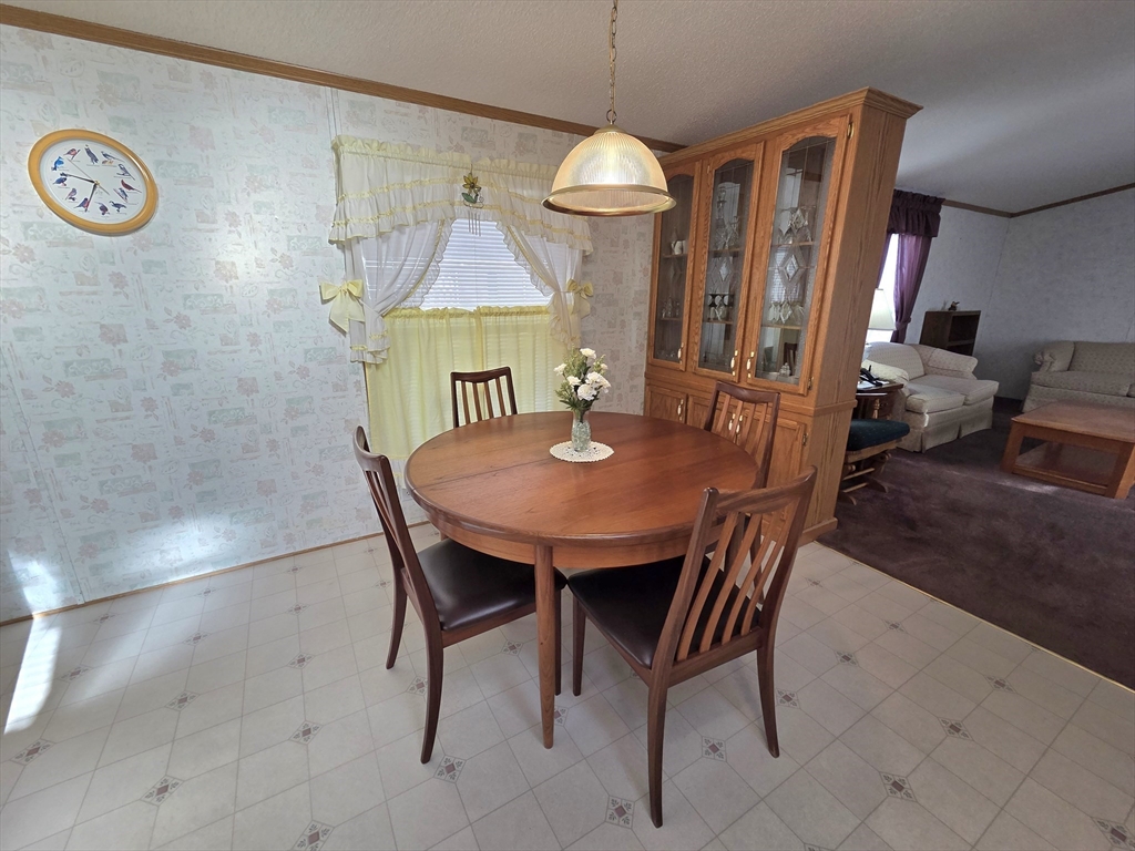 268 Palmer Road, Unit 59 Monson, MA 01057 - Photo 7 of 27 a view of a dining room with furniture