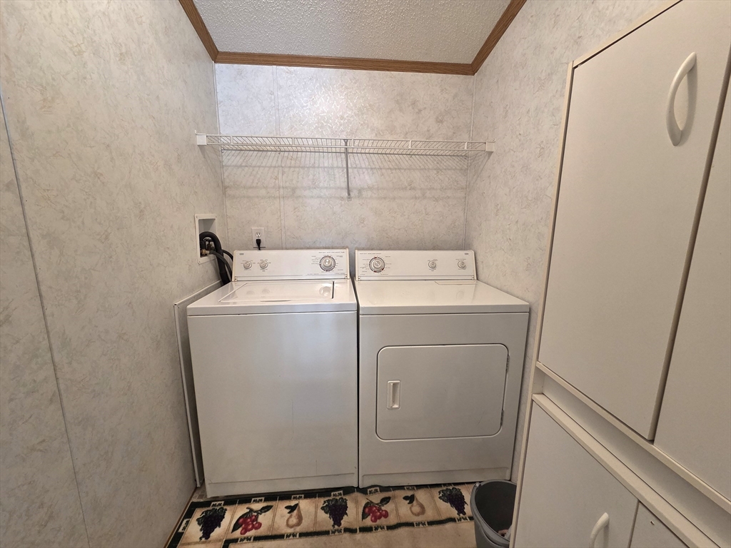 268 Palmer Road, Unit 59 Monson, MA 01057 - Photo 8 of 27 a utility room with dryer and washer