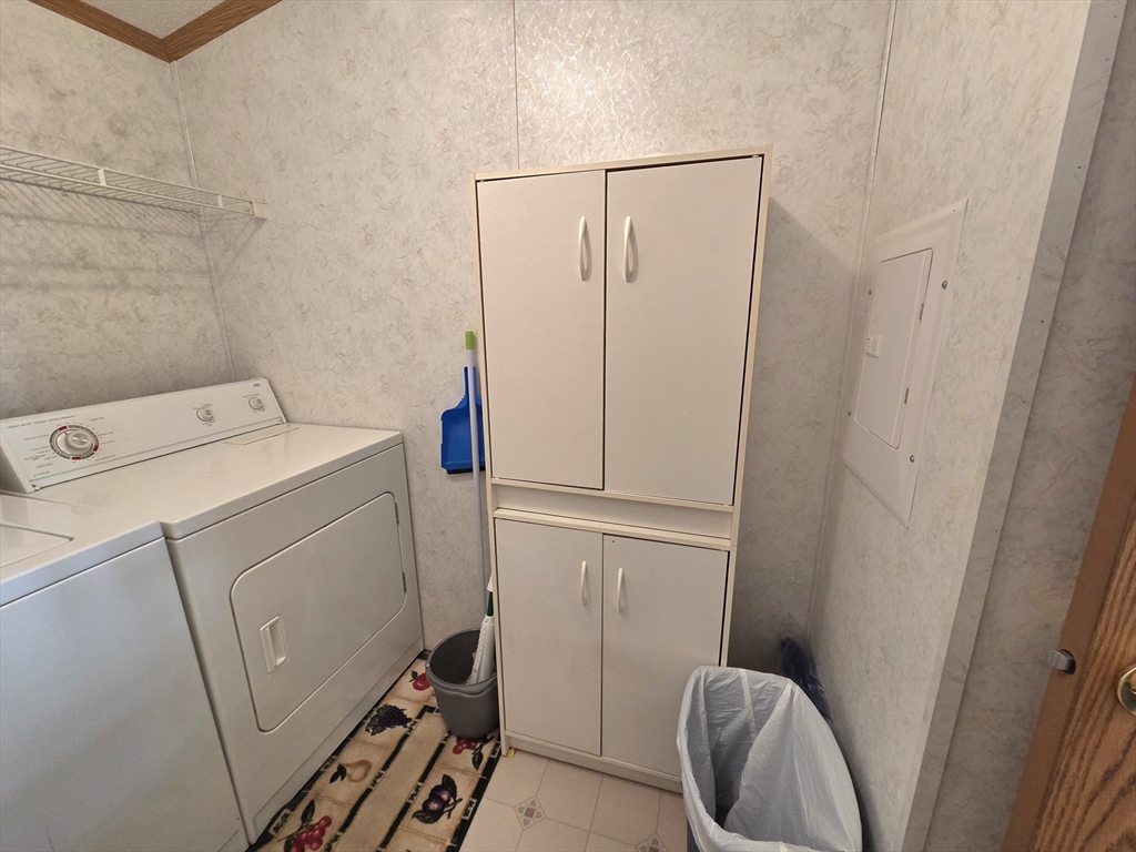 268 Palmer Road, Unit 59 Monson, MA 01057 - Photo 9 of 27 a utility room with dryer and washer