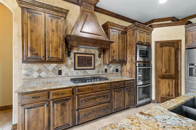 a kitchen with a sink stove and refrigerator