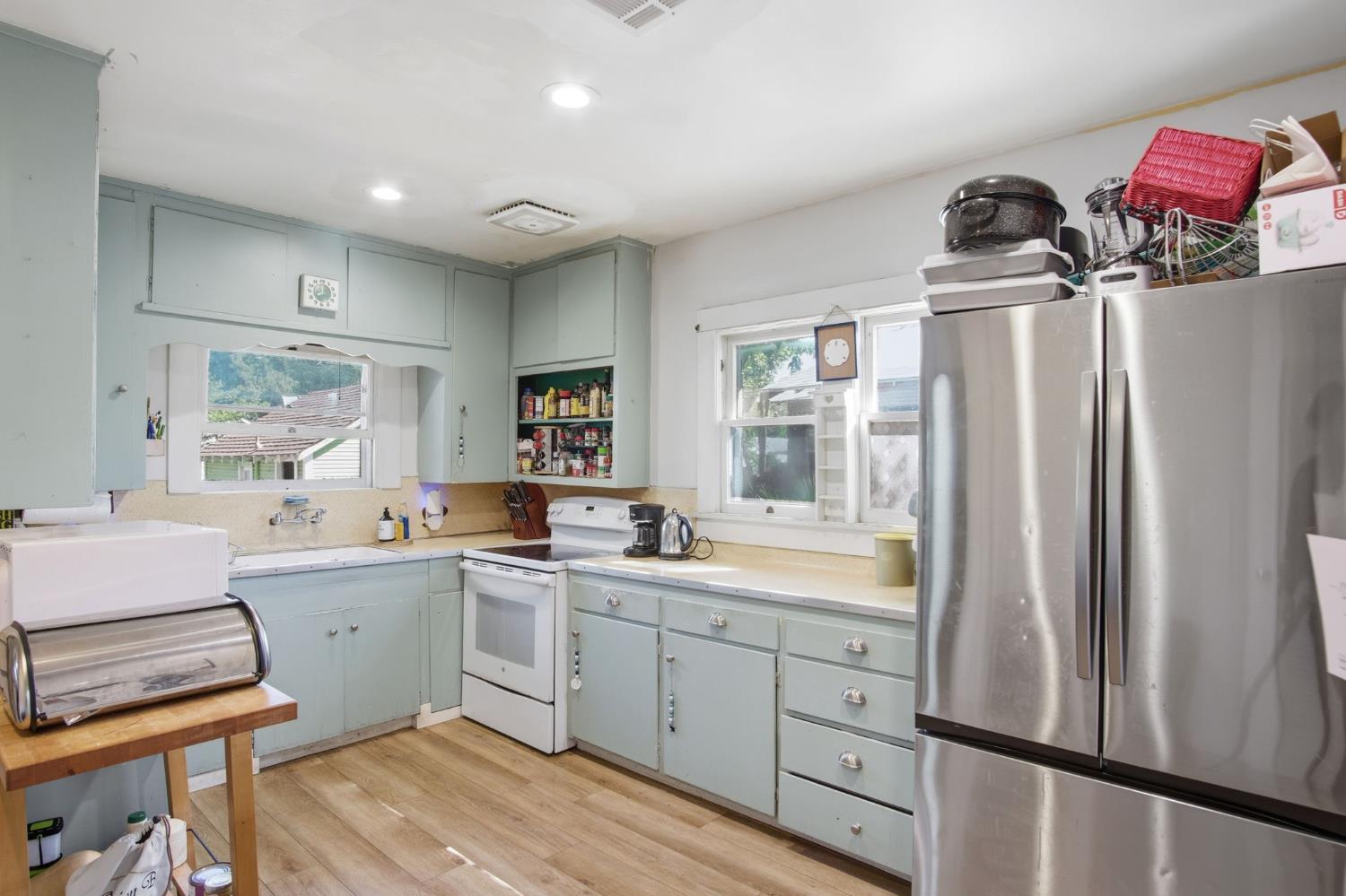 557 Florence Street Turlock, CA 95380 - Photo 11 of 36 a kitchen with a sink appliances and cabinets