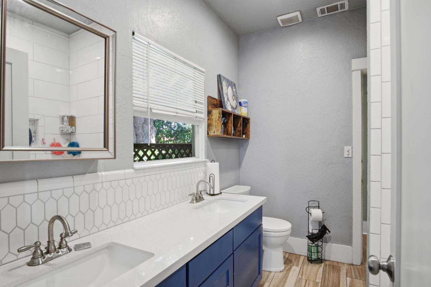 557 Florence Street Turlock, CA 95380 - Photo 17 of 36 a bathroom with a sink and a mirror