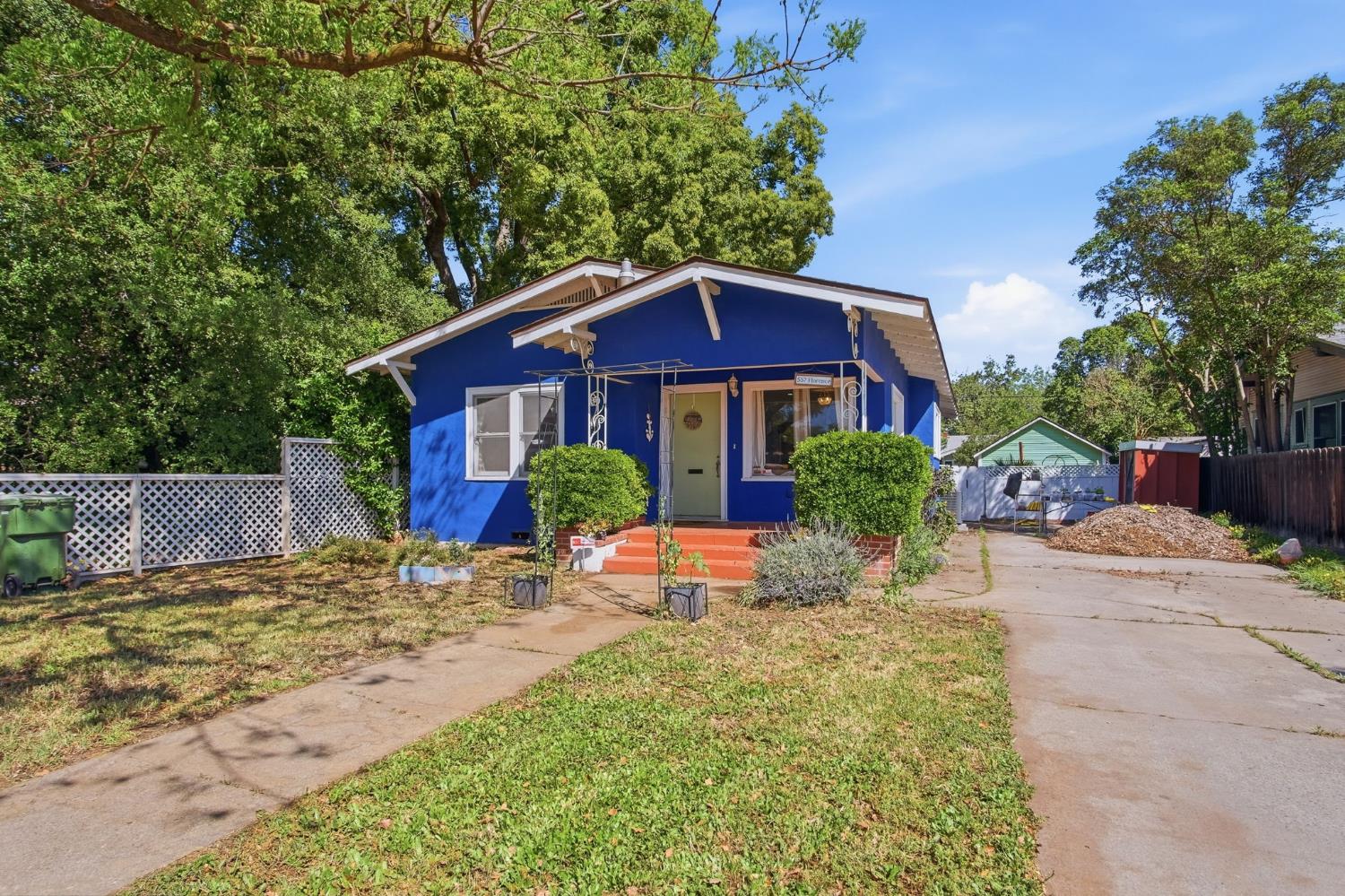 557 Florence Street Turlock, CA 95380 - Photo 2 of 36 a front view of a house with a yard