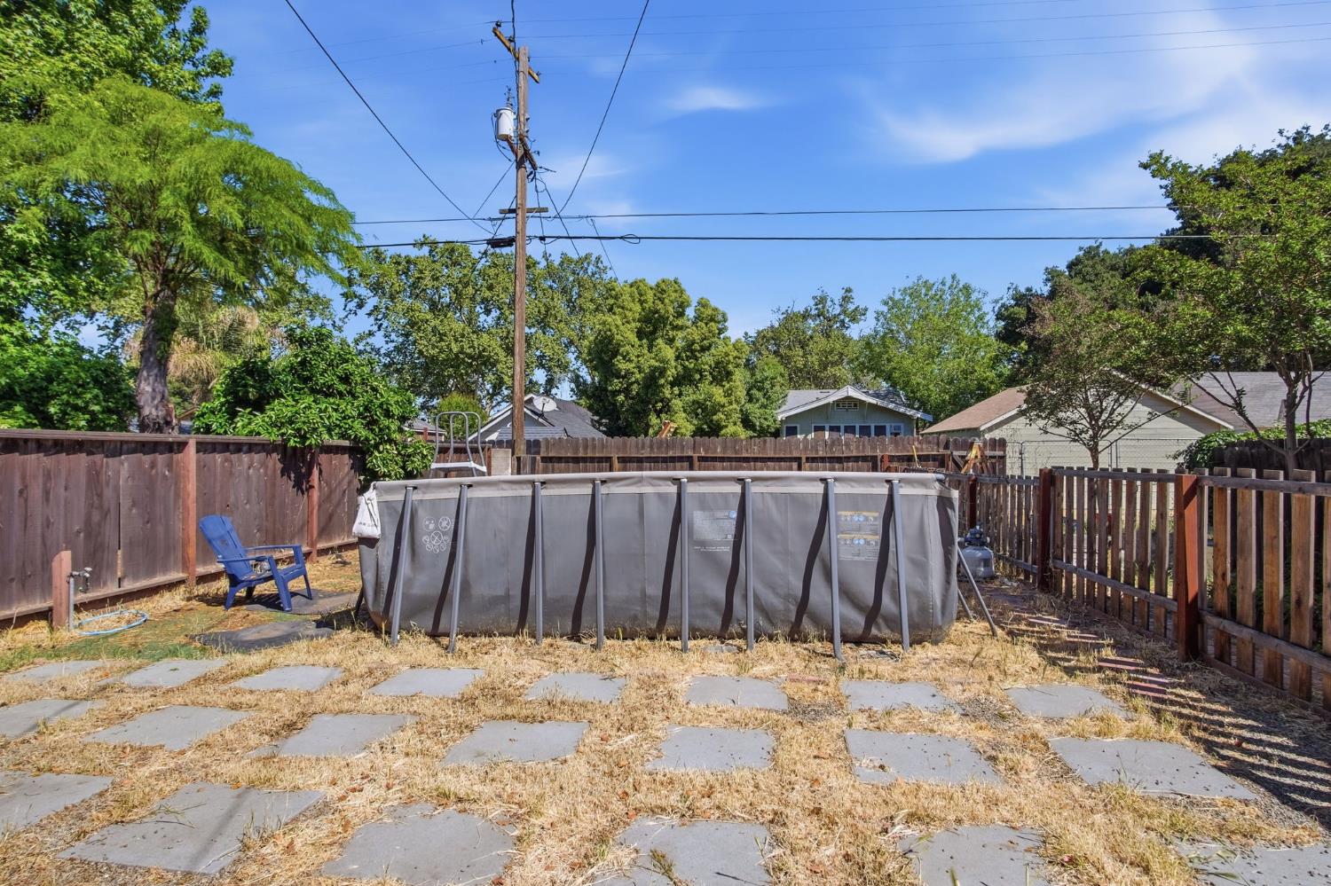 557 Florence Street Turlock, CA 95380 - Photo 25 of 36 a wooden fence with trees in the background