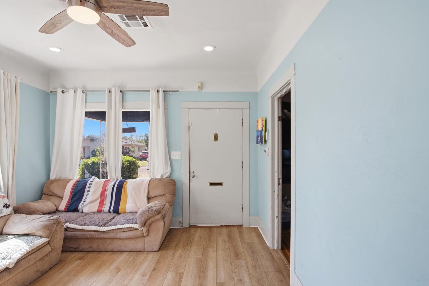 557 Florence Street Turlock, CA 95380 - Photo 6 of 36 a living room with furniture and a large window