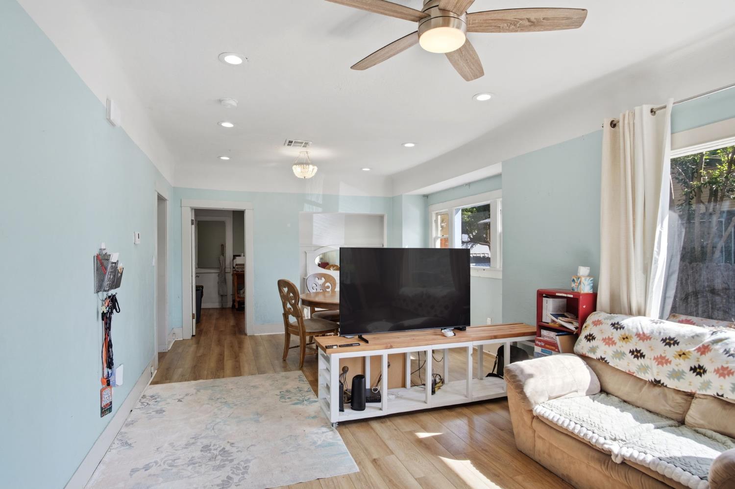 557 Florence Street Turlock, CA 95380 - Photo 7 of 36 a living room with furniture and a flat screen tv