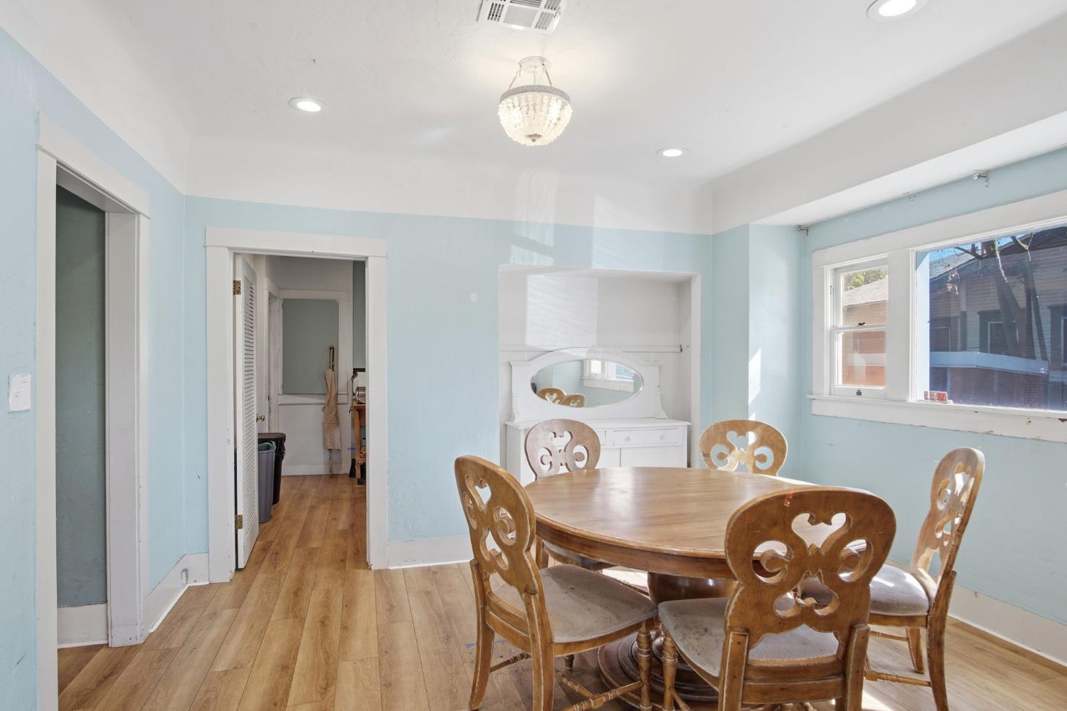 557 Florence Street Turlock, CA 95380 - Photo 8 of 36 a view of a dining room with furniture and wooden floor