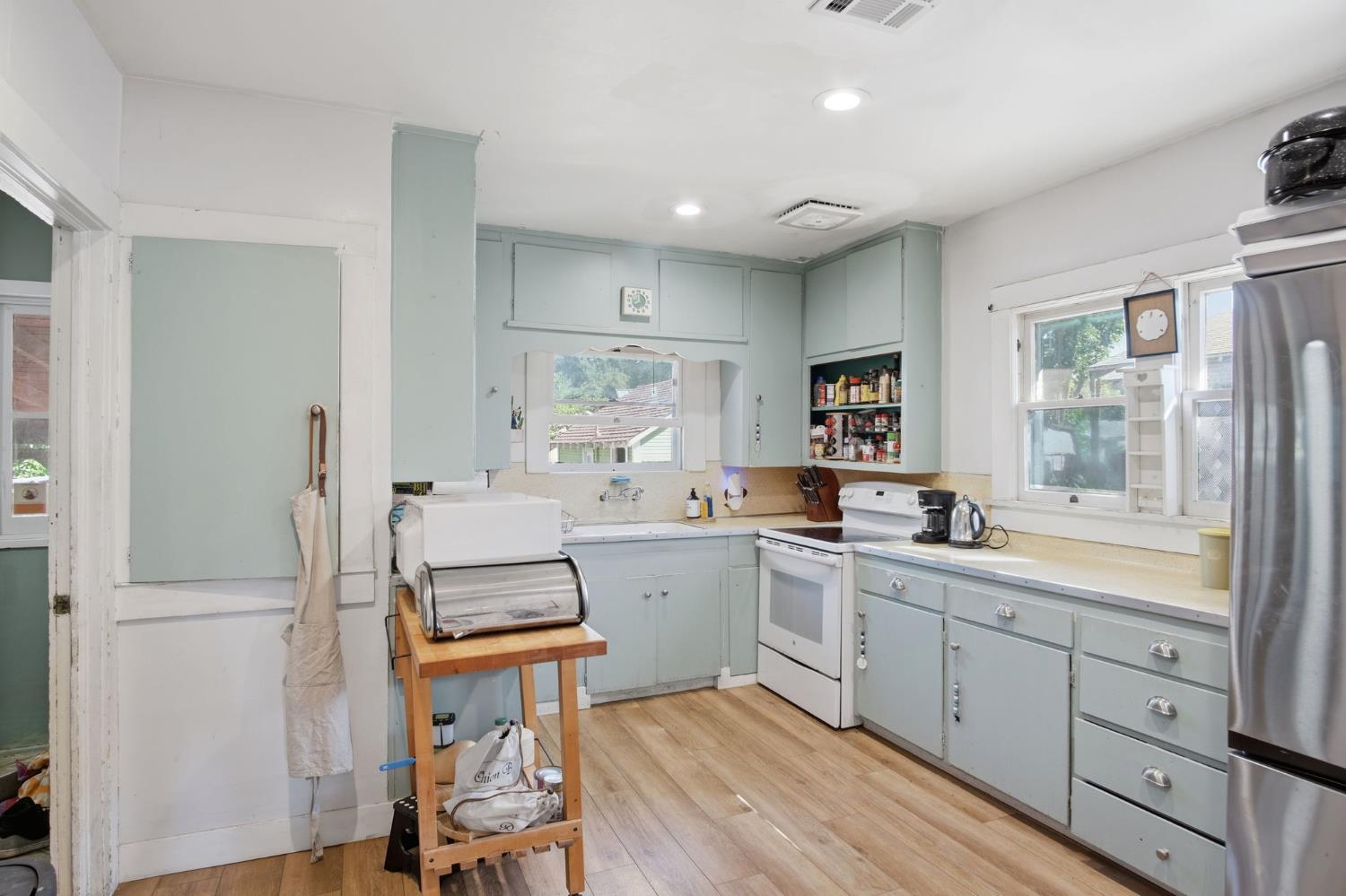557 Florence Street Turlock, CA 95380 - Photo 10 of 36 a kitchen with a sink window and cabinets