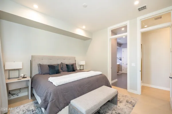 a bathroom with a granite countertop toilet a sink and a shower