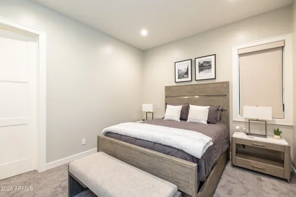 a view of a lake with a big yard and a large mountain view