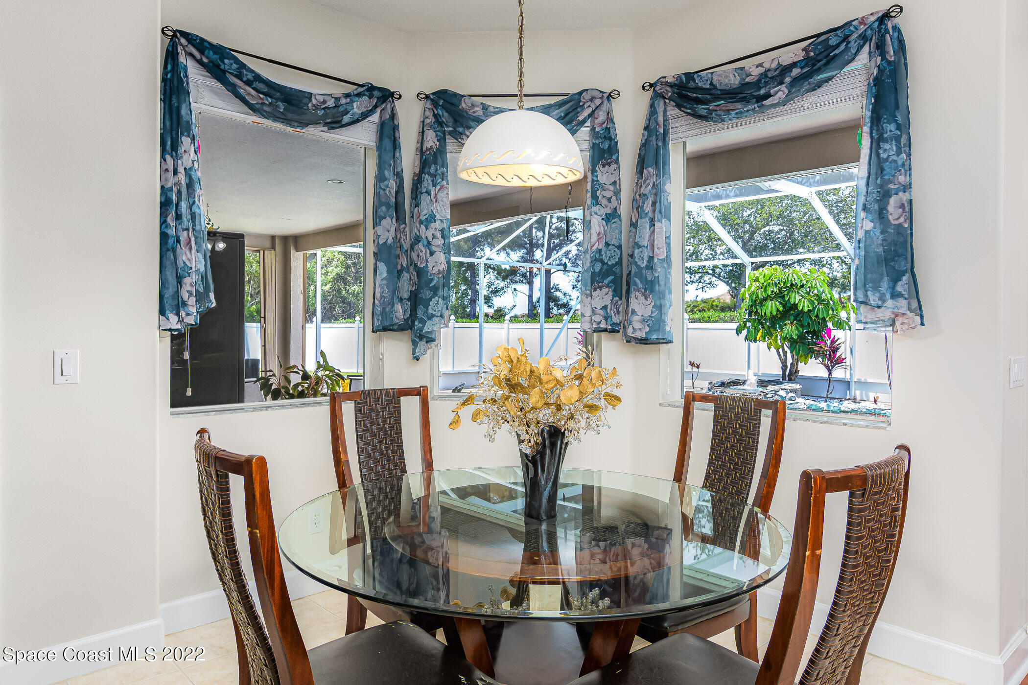 3832 Stream Drive Melbourne, FL 32940 - Photo 15 of 63 a view of a dining room with furniture and window