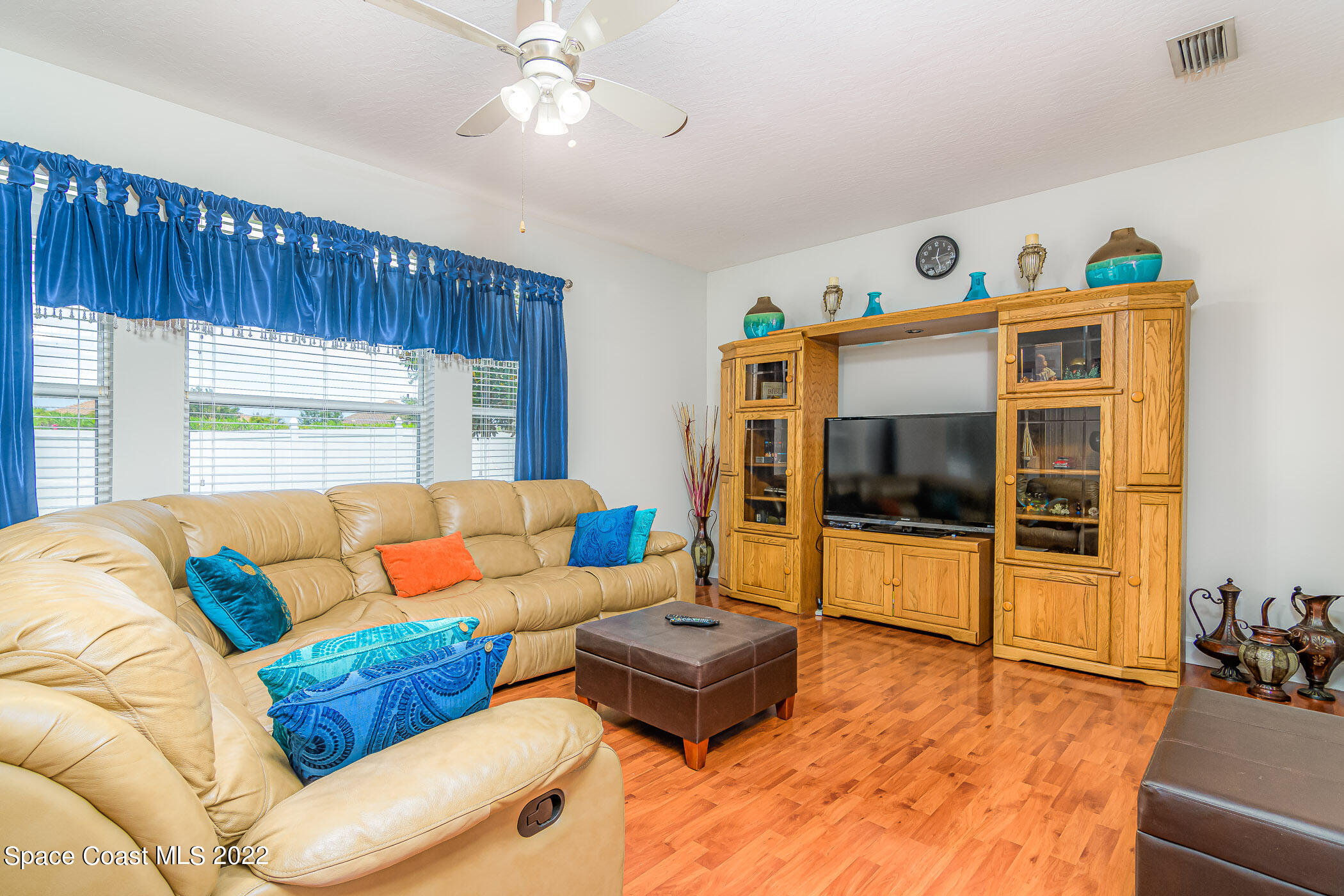 3832 Stream Drive Melbourne, FL 32940 - Photo 16 of 63 a living room with furniture and a flat screen tv