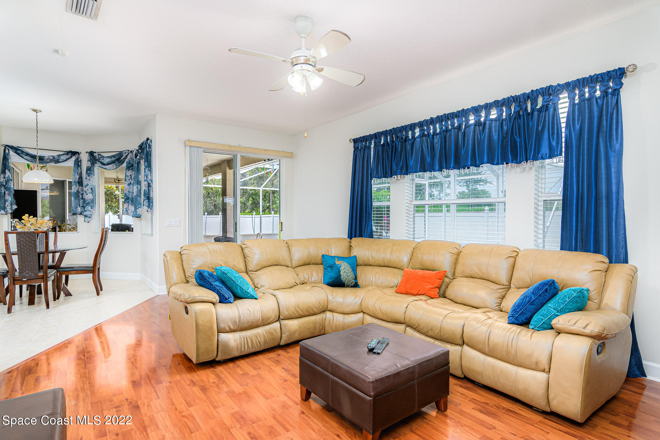 3832 Stream Drive Melbourne, FL 32940 - Photo 17 of 63 a living room with furniture kitchen view and a large window