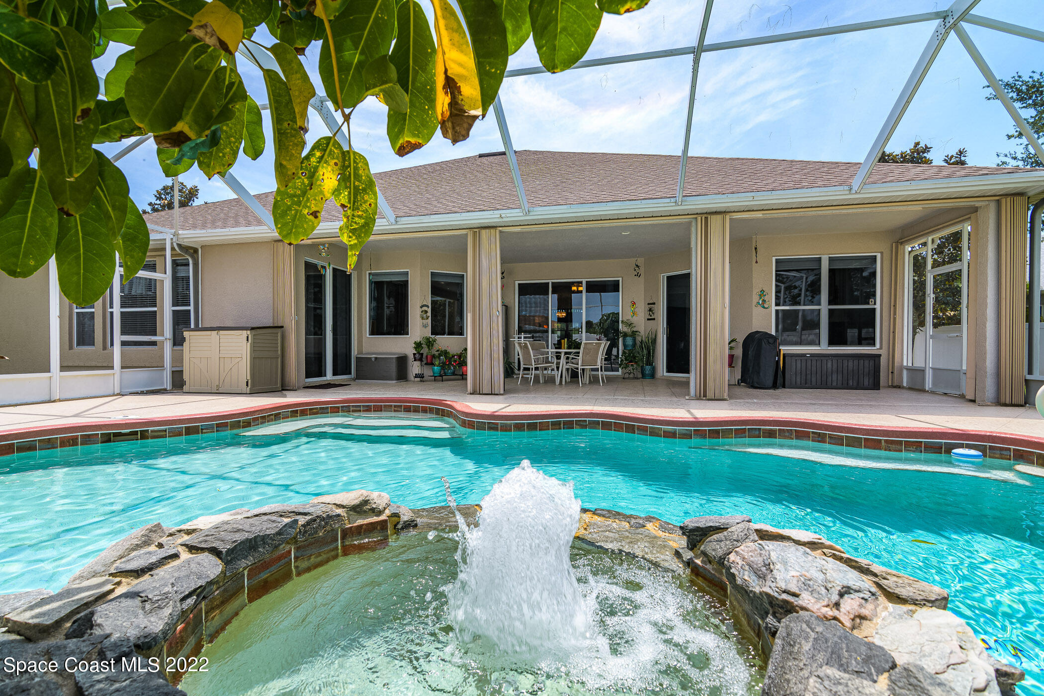 3832 Stream Drive Melbourne, FL 32940 - Photo 30 of 63 a view of a house with swimming pool and porch
