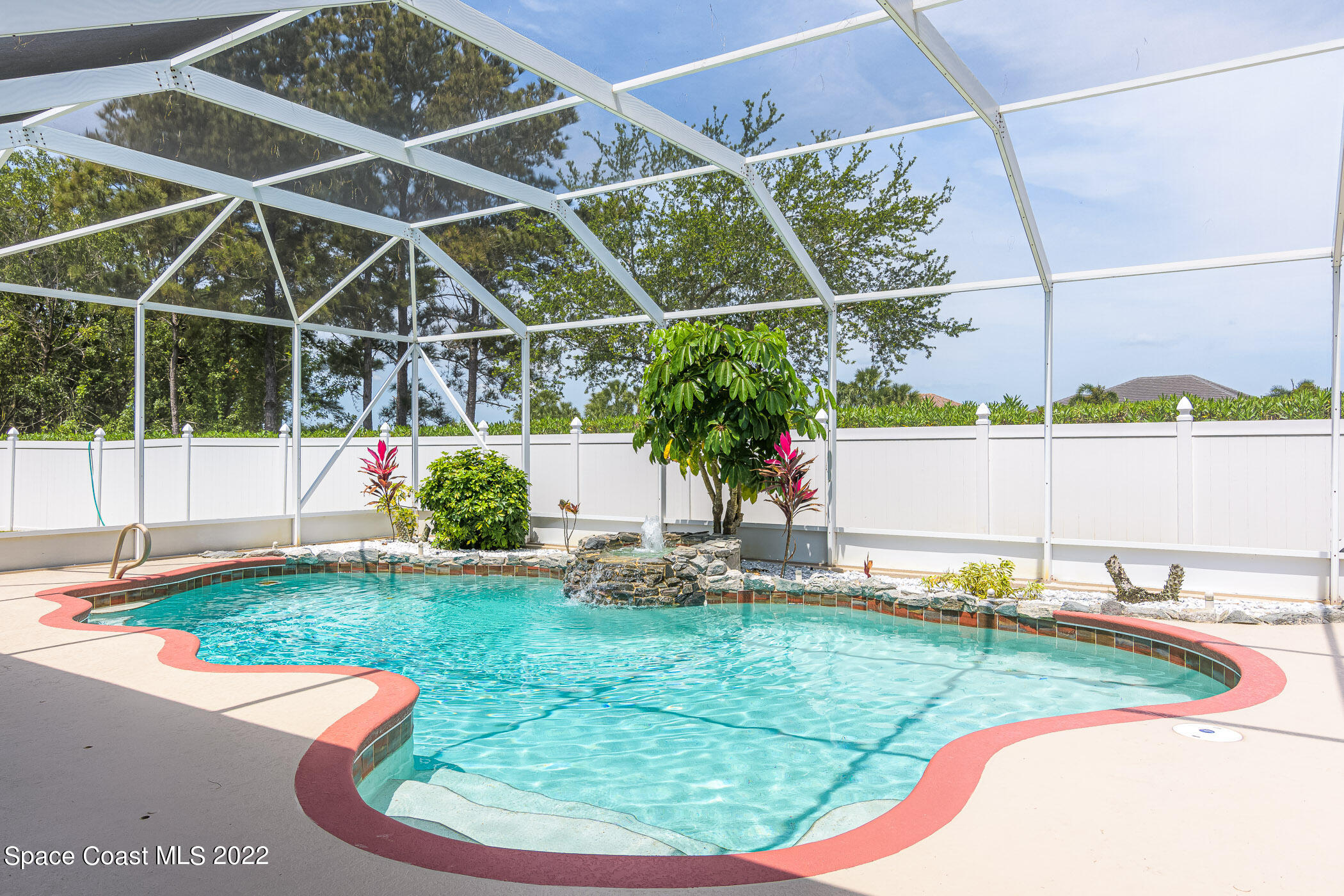 3832 Stream Drive Melbourne, FL 32940 - Photo 31 of 63 a view of a backyard with table and chairs potted plants