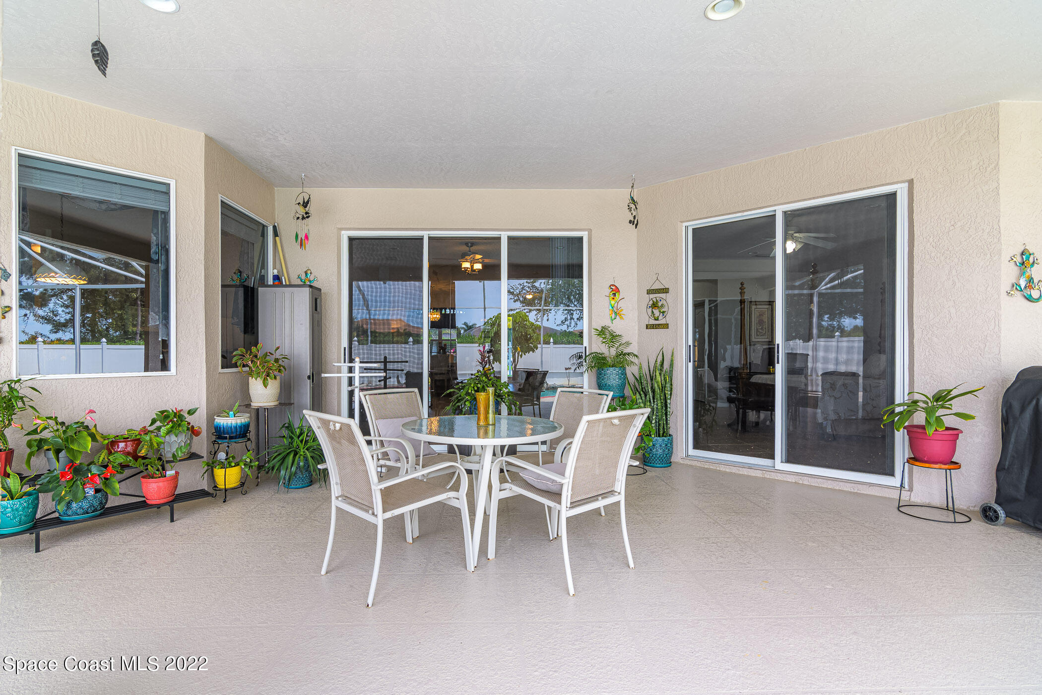 3832 Stream Drive Melbourne, FL 32940 - Photo 32 of 63 a dining room with furniture and garden view