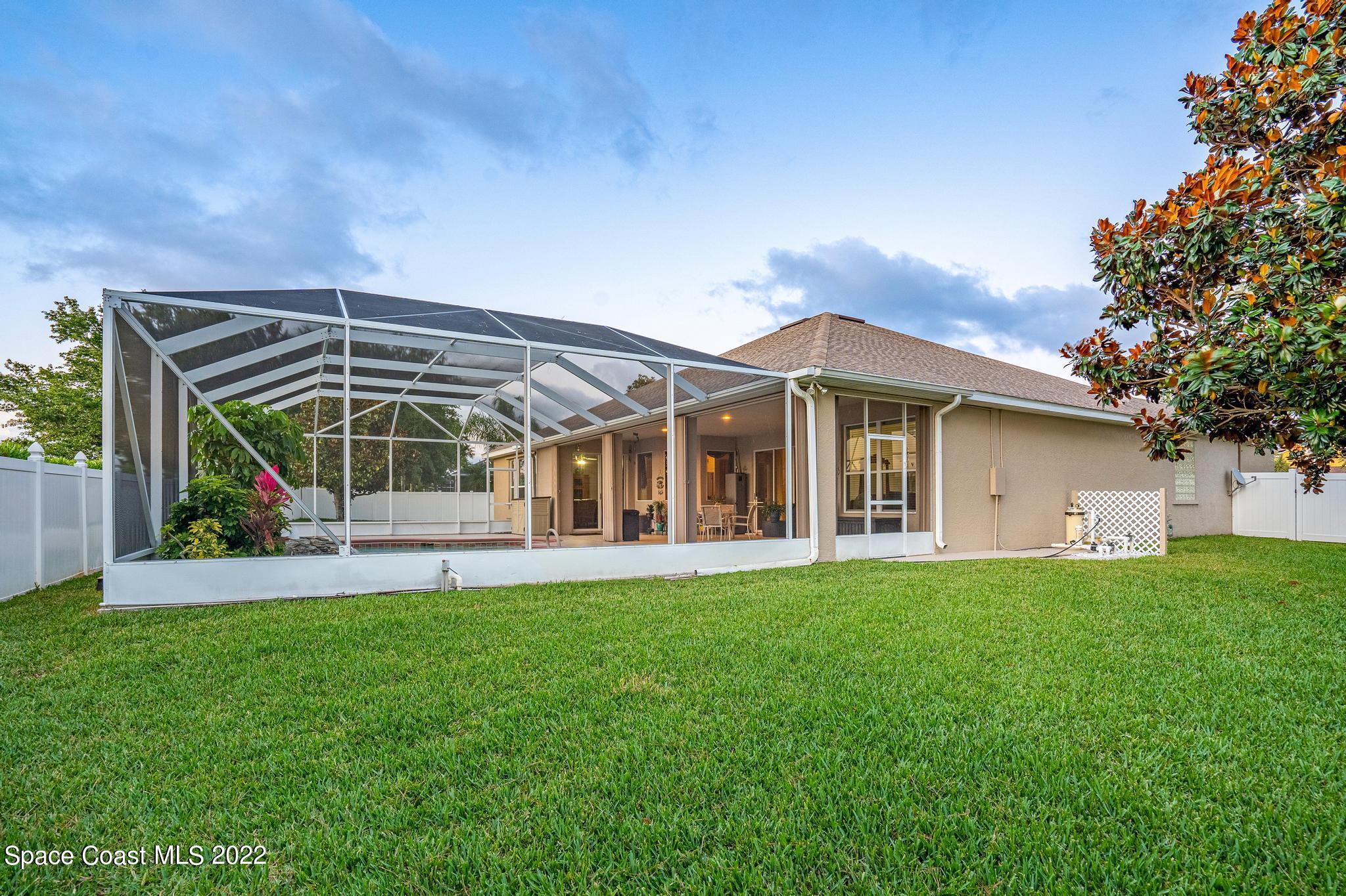 3832 Stream Drive Melbourne, FL 32940 - Photo 37 of 63 front view of a house with a yard