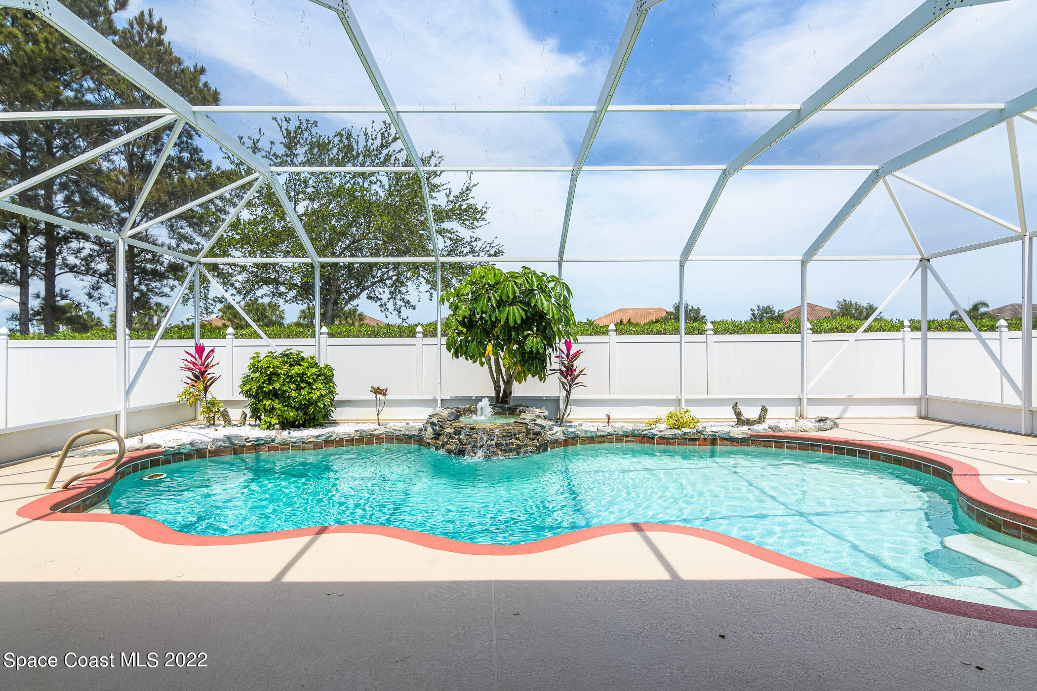3832 Stream Drive Melbourne, FL 32940 - Photo 42 of 63 a view of a backyard with table and chairs and plants