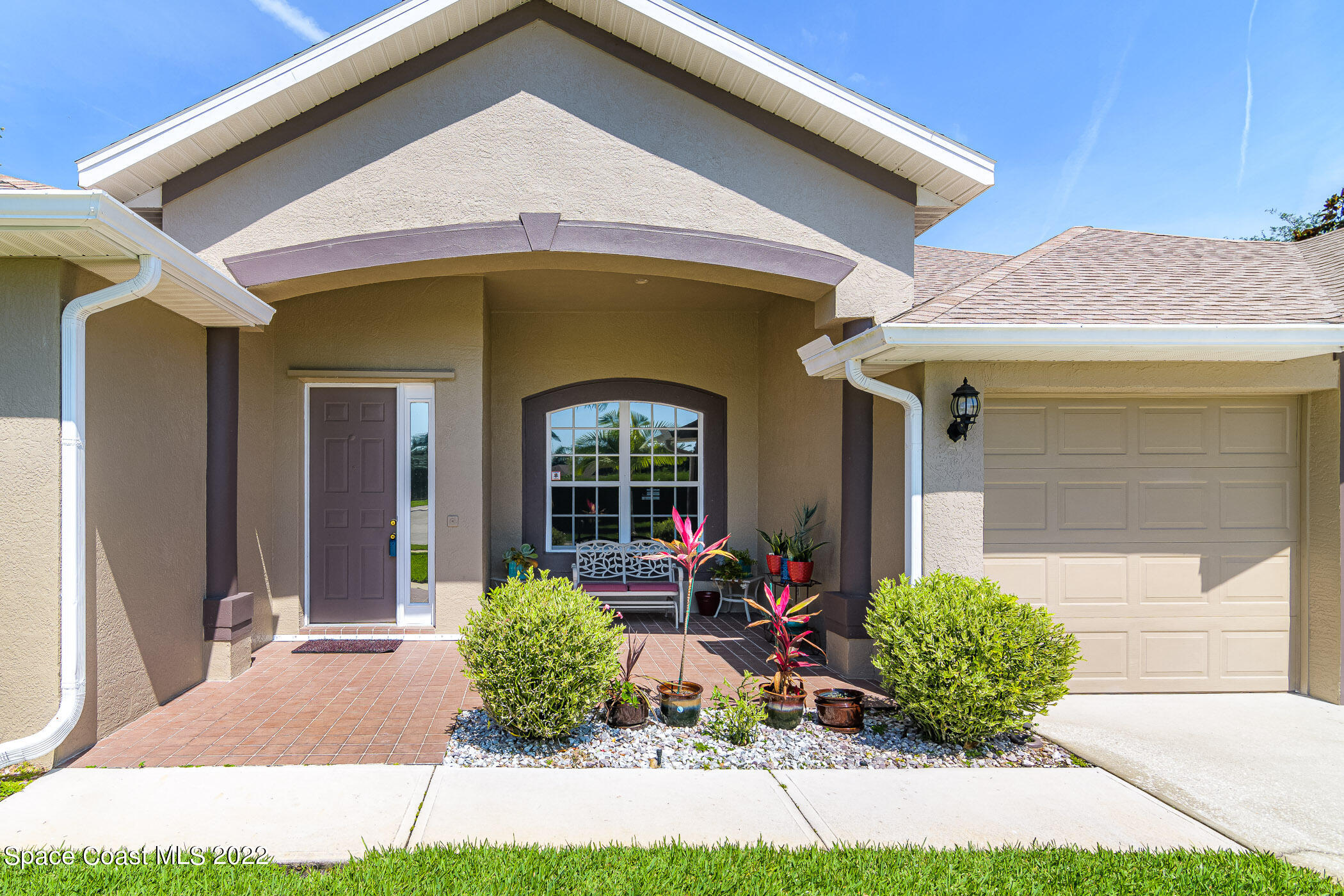 3832 Stream Drive Melbourne, FL 32940 - Photo 48 of 63 a front view of a house with garden