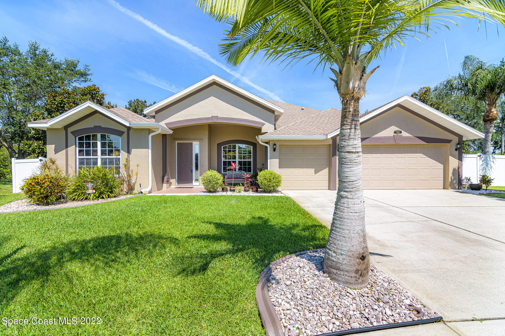 3832 Stream Drive Melbourne, FL 32940 - Photo 49 of 63 a front view of a house with a garden and plants