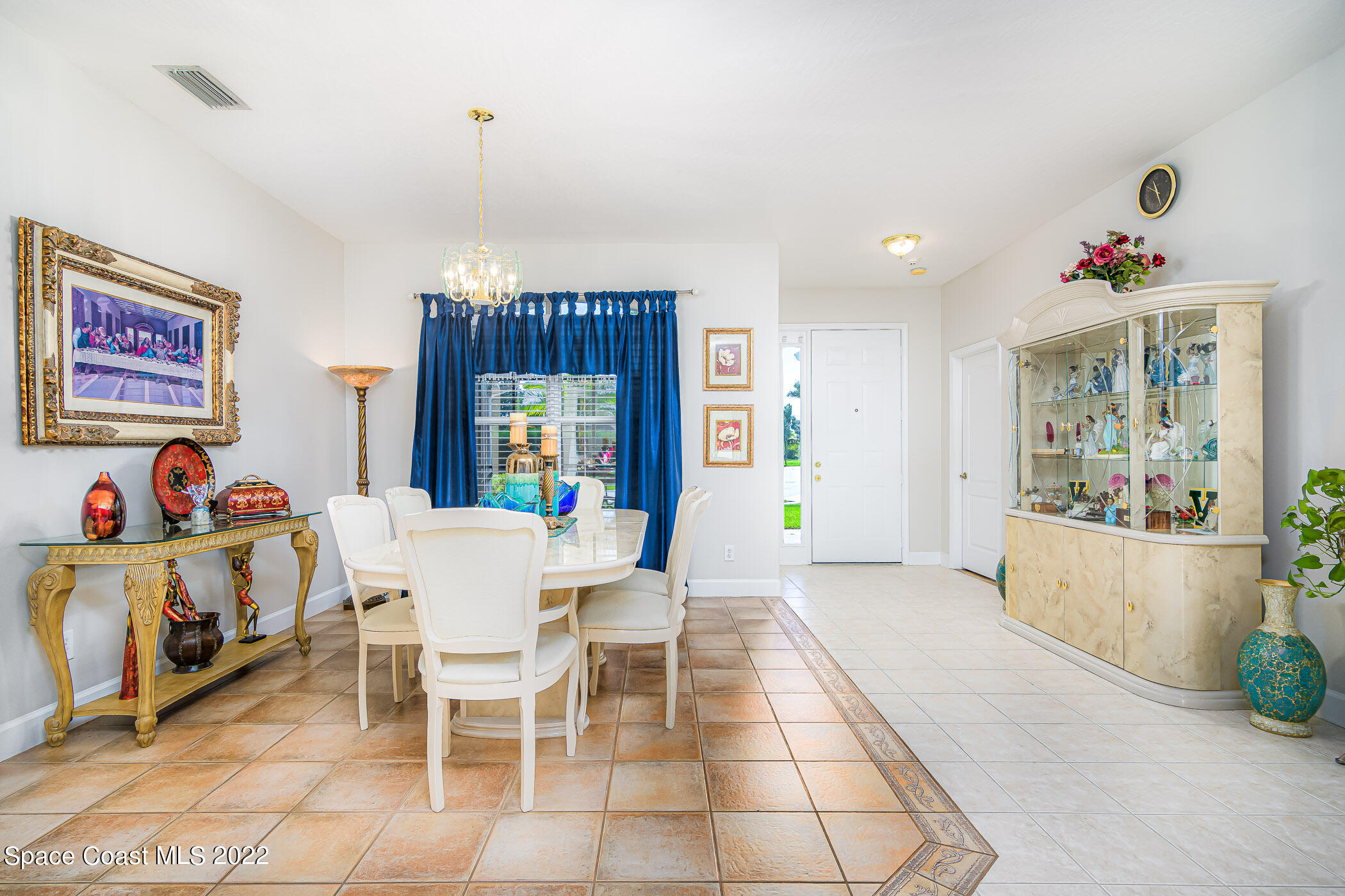 3832 Stream Drive Melbourne, FL 32940 - Photo 55 of 63 a view of a dining room with furniture and chandelier
