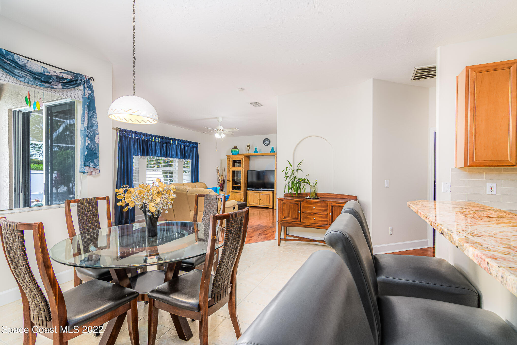 3832 Stream Drive Melbourne, FL 32940 - Photo 56 of 63 a view of a dining room with furniture window and outside view
