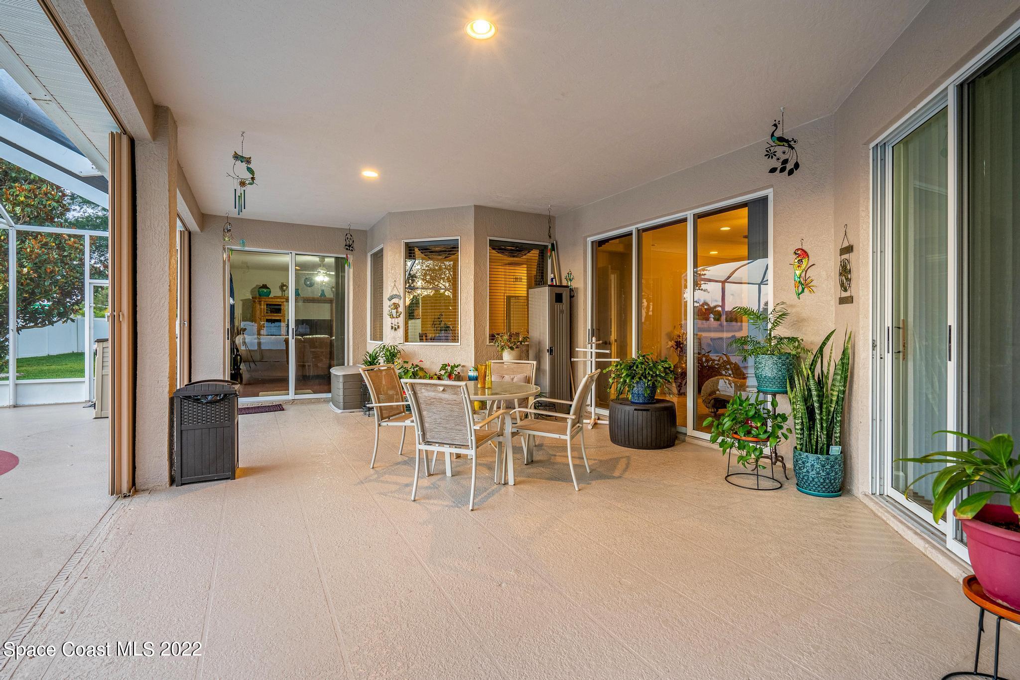 3832 Stream Drive Melbourne, FL 32940 - Photo 58 of 63 a view of a dining room with furniture window and outside view
